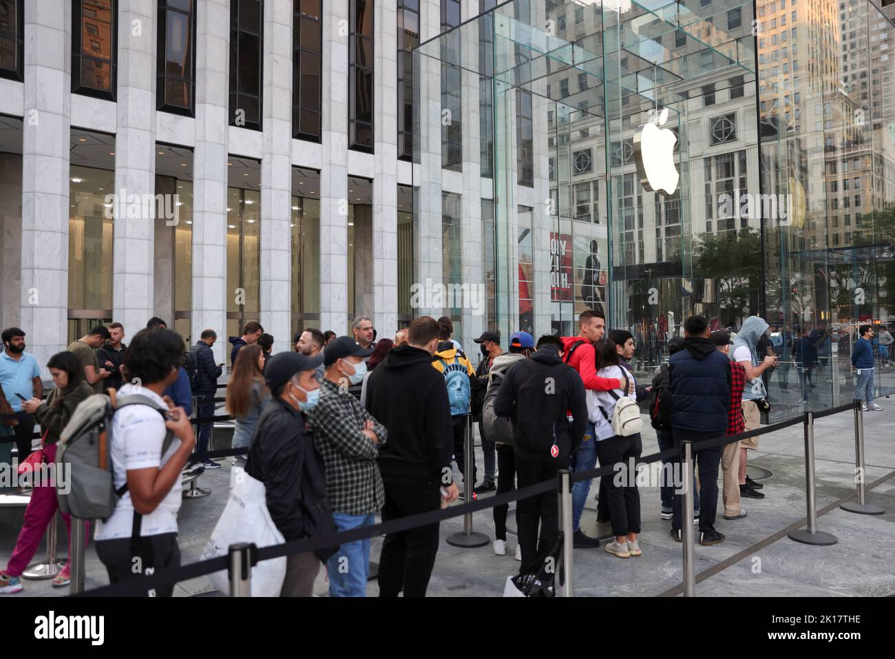 People line up outside the Apple Fifth Avenue store for the release of the iPhone 14, in Manhattan, New York City U.S. September 16, 2022. REUTERS/Andrew Kelly Stock Photo