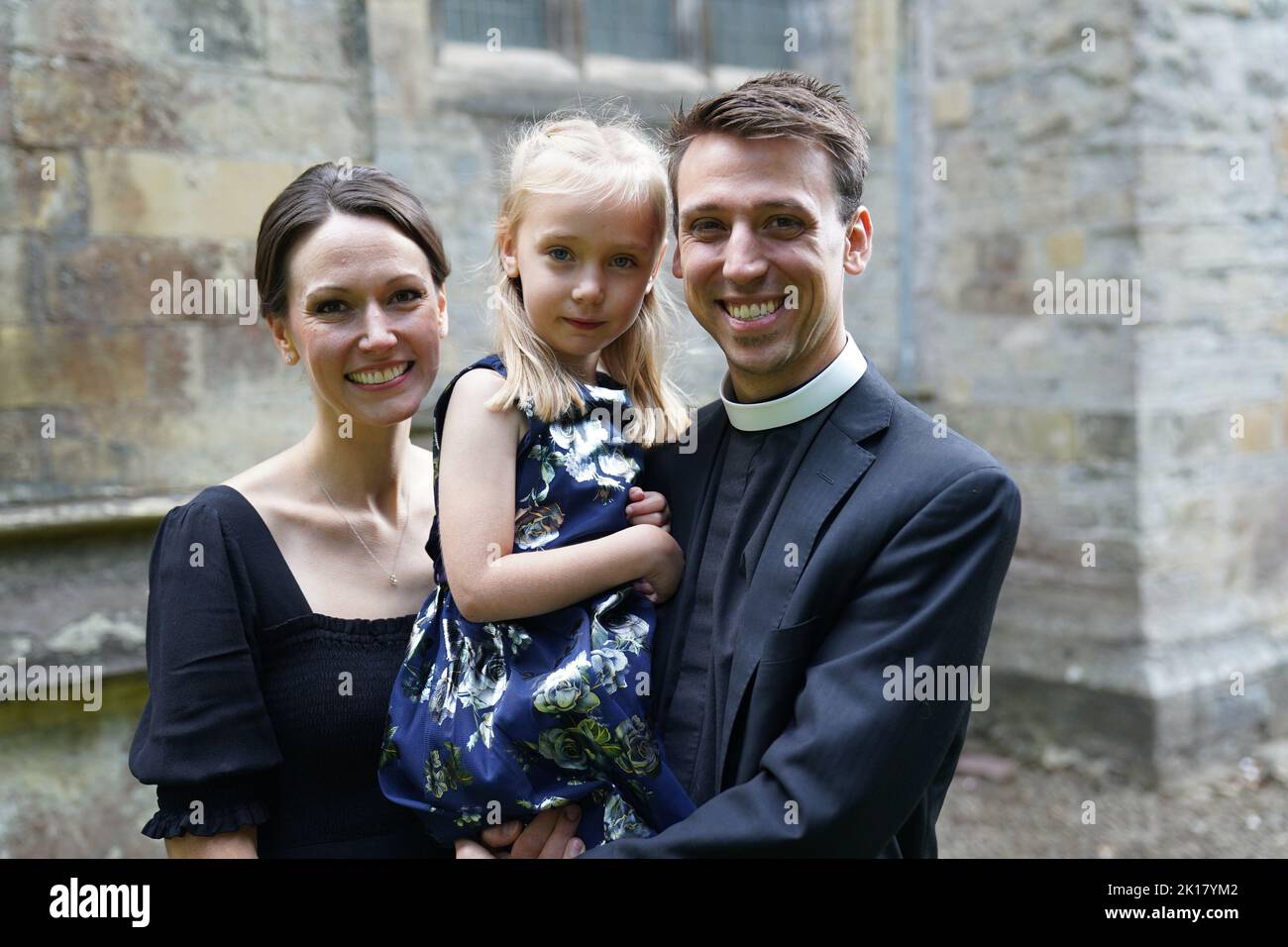 Keira Hillebert and her parents Krisi and Jordan. Keira who was born in Wales but whose parents are from Atlanta, Georgia got her first British passport on the day the Queen died. The five-year-old presented the Queen Consort with a posey after she and King Charles III attended a Service of Prayer and Reflection Llandaff Cathedral in Cardiff, for the life of Queen Elizabeth II. See PA story DEATH Queen. Photo credit should read: Jacob King/PA Wire Stock Photo