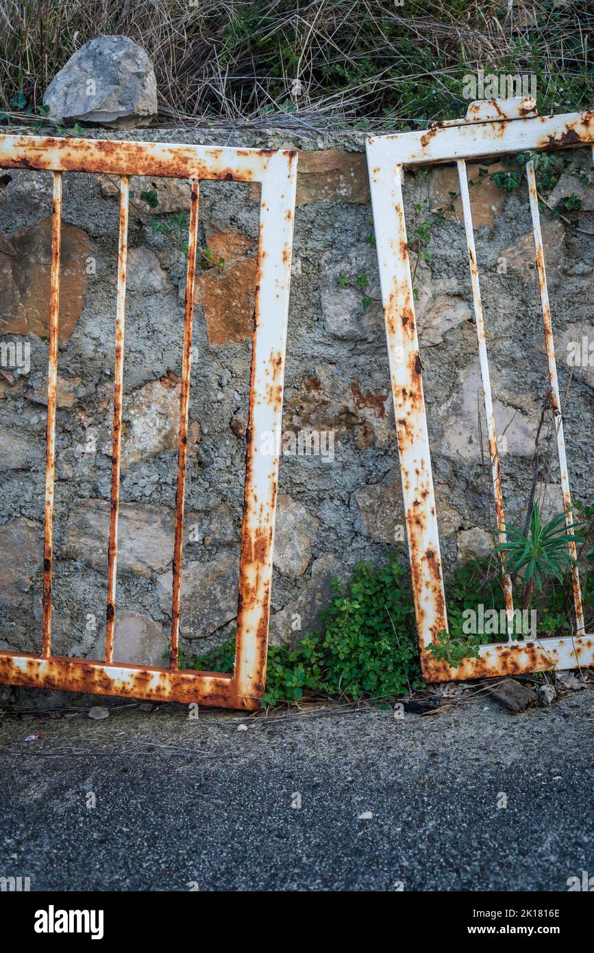Abandoned rusty gate, Village of Mali Iz, sland of Iz, Zadar archipelago, Dalmatia, Croatia Stock Photo