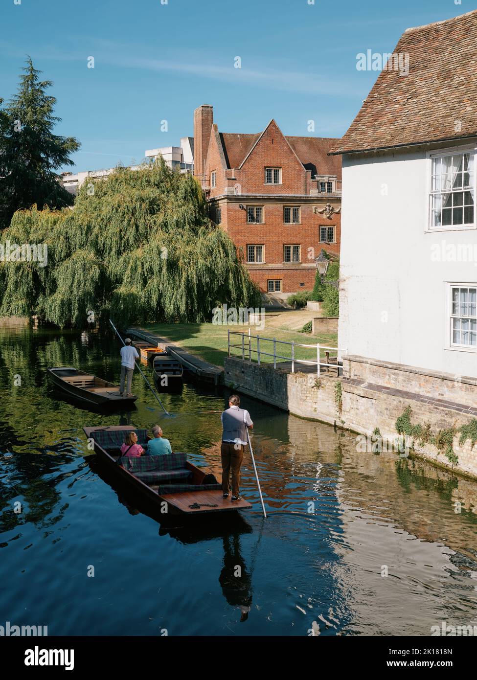 The view from Magdalene Bridge with punts touring the River Cam on a summer day in Cambridge Cambridgeshire England UK Stock Photo