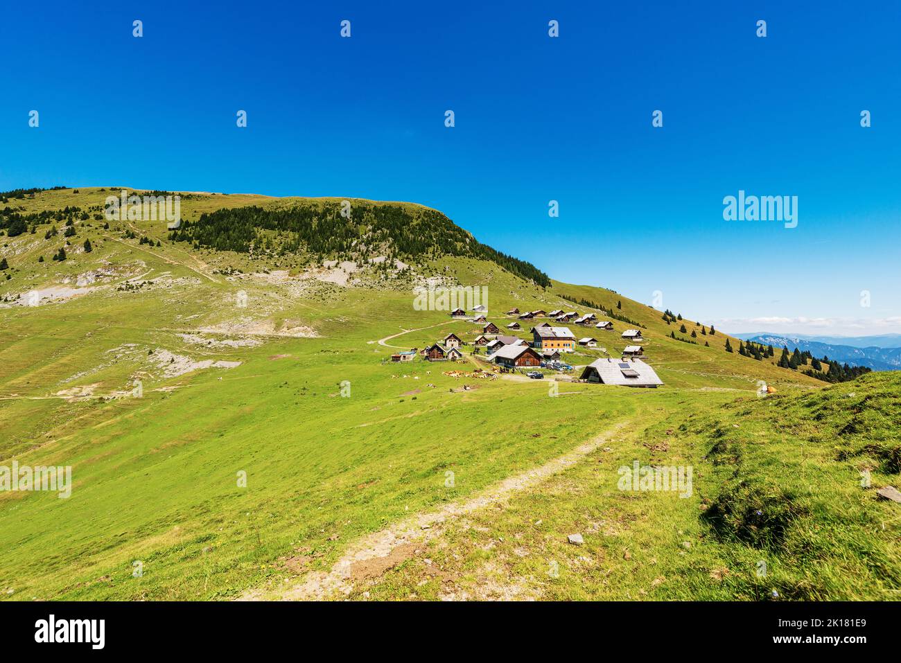 Village and Osternig or Oisternig mountain peak, Carnic Alps, Feistritz an der Gail municipality, Austria, Carinthia, Europe. Italy-Austria Border. Stock Photo