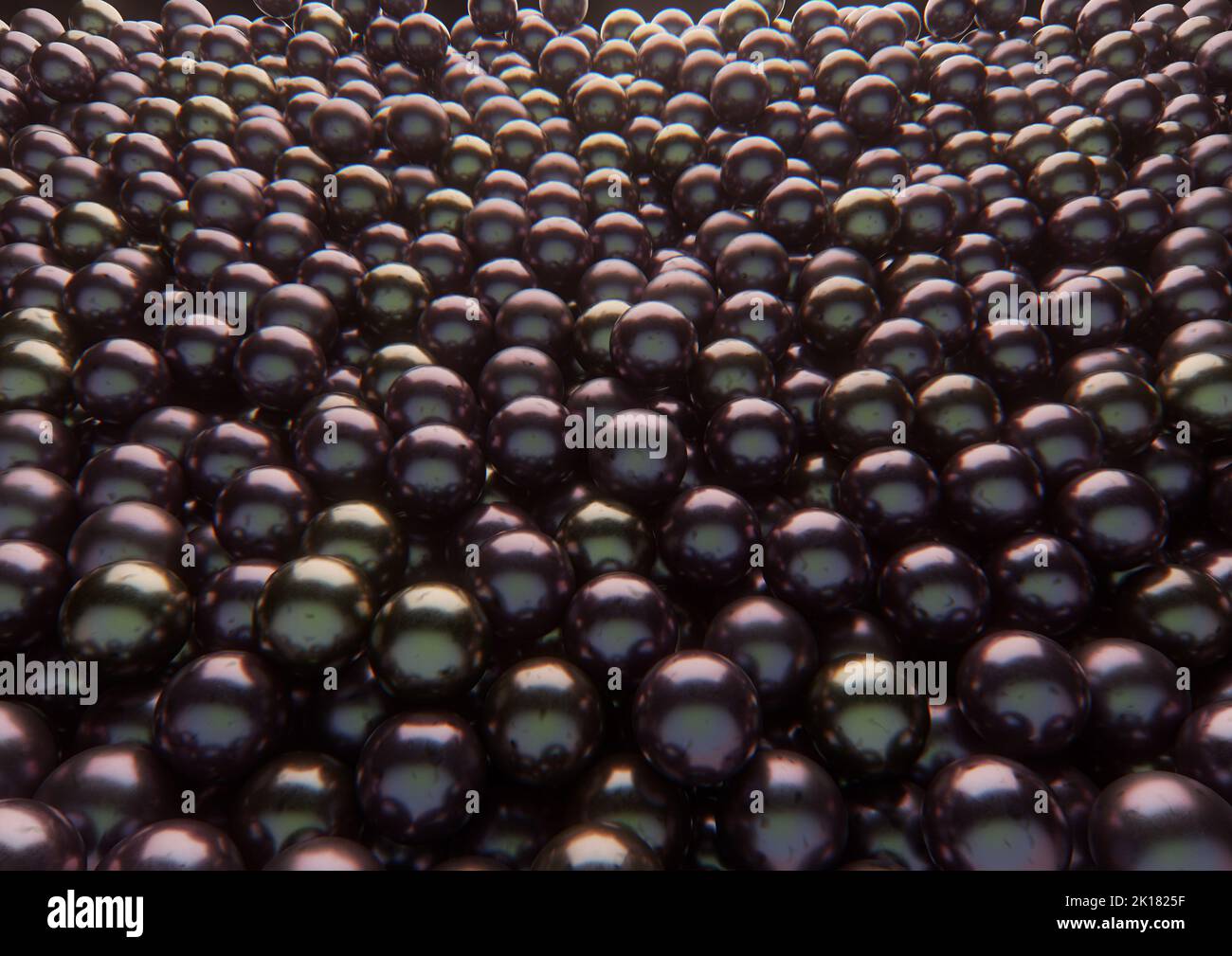An array of black shiny pearls spread out to form an solid background - 3D render Stock Photo