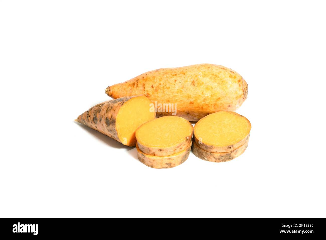 Sweet yellow potato uncooked isolated on white background closeup. Stock Photo