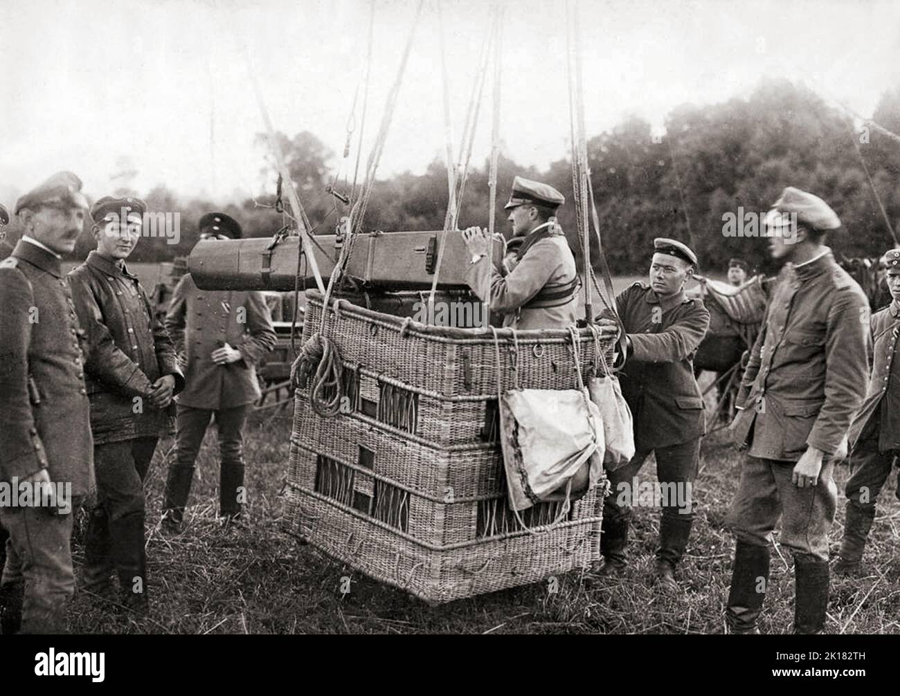 A German observation balloon fitted with a long-distance camera. 1916. They were employed as an aerial platform for intelligence gathering and artillery spotting. The balloons were filled with hydrogen gas, whose flammable nature led to the destruction of hundreds of balloons on both sides. Typically, balloons were tethered to a steel cable attached to a winch that reeled the gasbag to its desired height (usually 1,000-1,500 metres) and retrieved it at the end of an observation session. Stock Photo