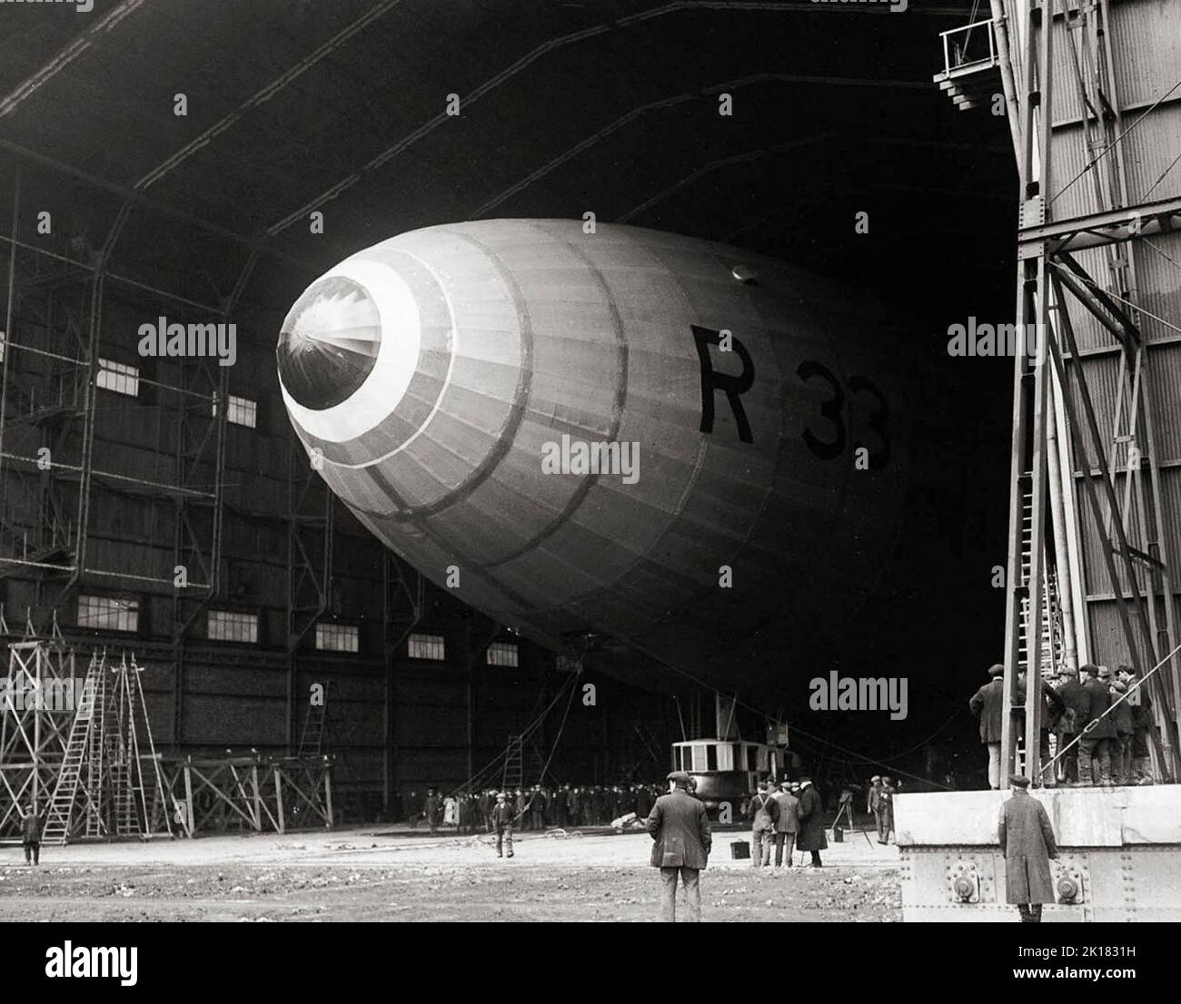 Airship R33 a British rigid airship, in its hanger at  RAF Pulham in Norfolk, England in 1925. The airships were built by Armstrong Whitworth for the Royal Naval Air Service during the First World War, but were not completed until after the end of hostilities, by which time the RNAS had become part of the Royal Air Force. Her first flight was in early 1919 then sent to Pulham airship station she clocked up over 300 flying hours in tests and the training of crew. Stock Photo
