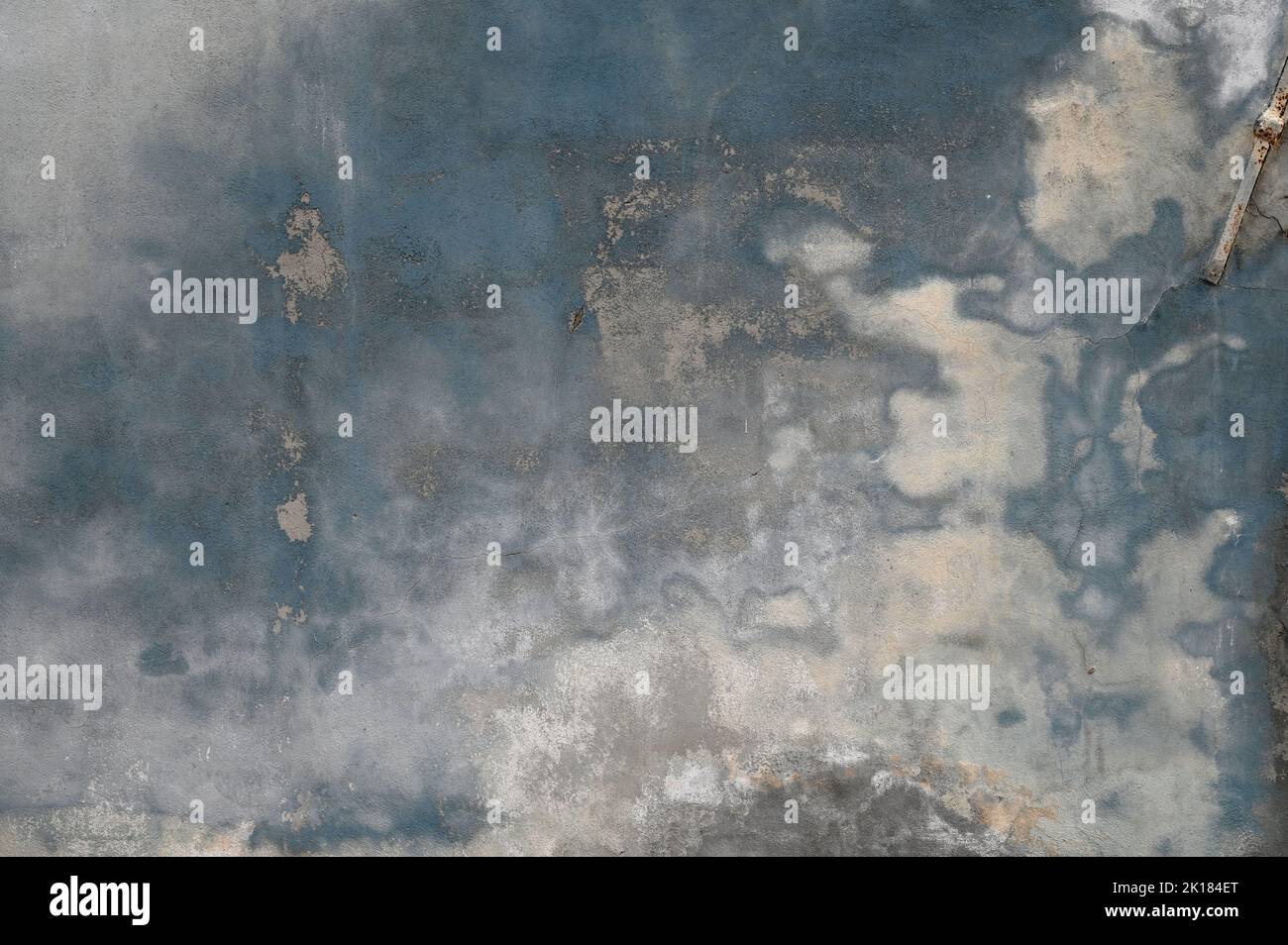Textured background of gray wall of shabby building covered with abstract fantasy stains Stock Photo