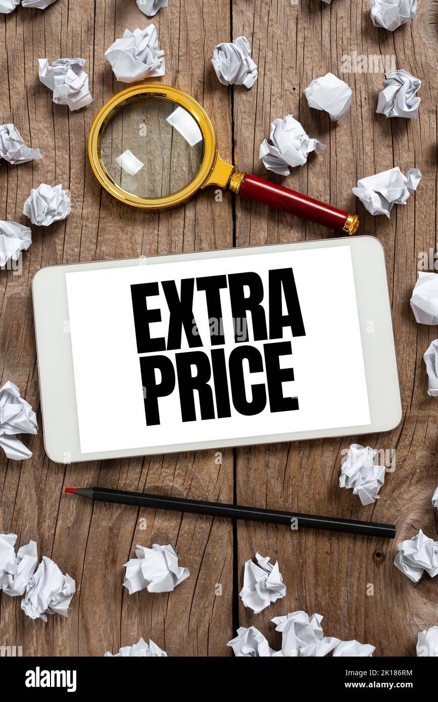 Sign displaying Extra Price. Word for extra price definition beyond the ordinary large degree