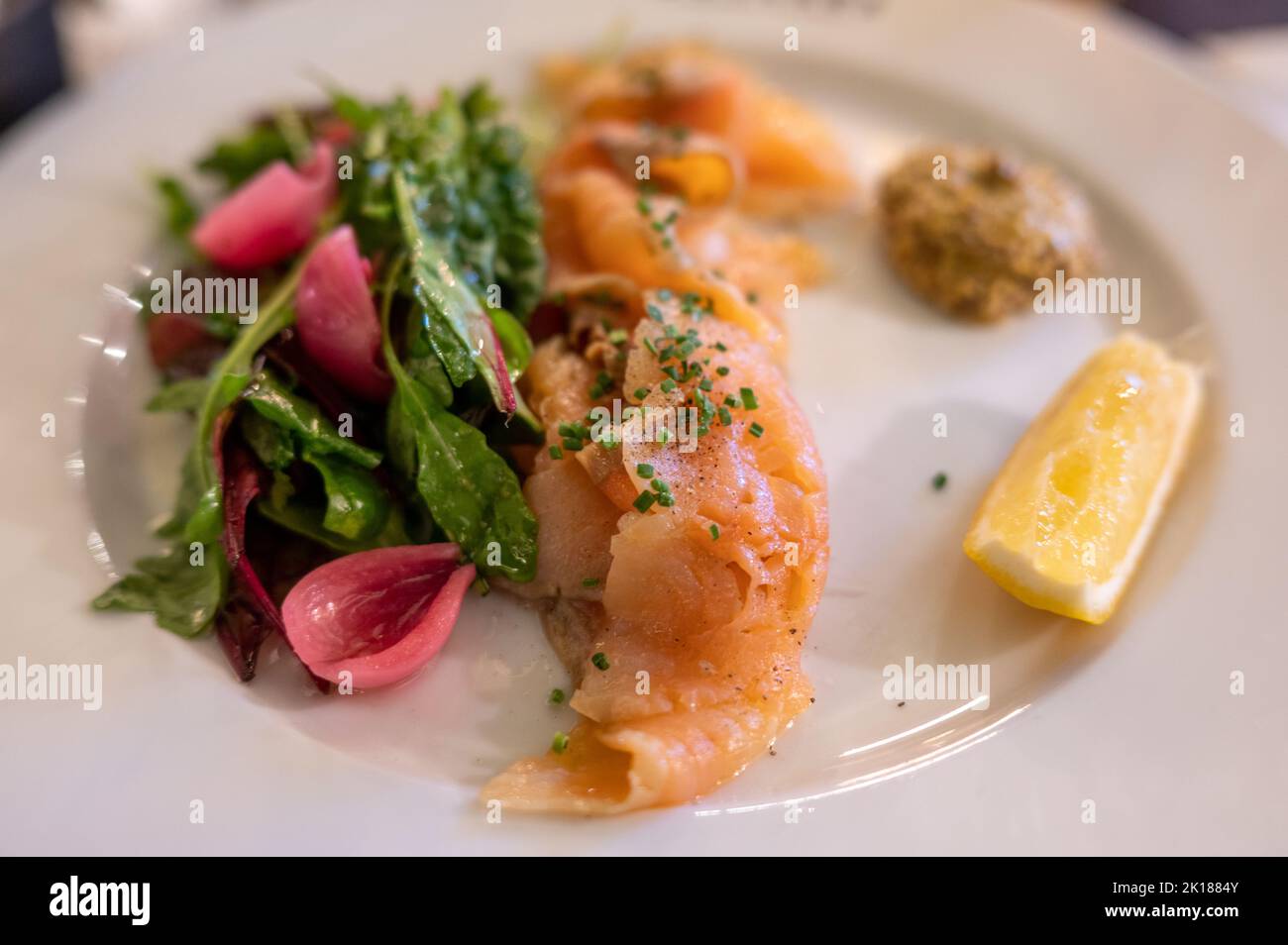Brined salmon is a traditional dish in Sweden. Brining implies a larger proportion of salt in relation to sugar compared to Gravlax or graved salmon Stock Photo