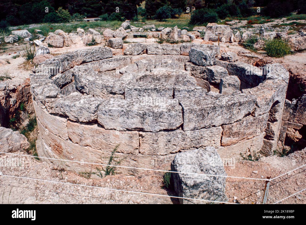 The Tholos at Epidaurus - a small city (polis) in ancient Greece, on the Argolid Peninsula at the Saronic Gulf, best known for its ancient Greek sanctuary. March 1980. Archival scan from a slide. Stock Photo