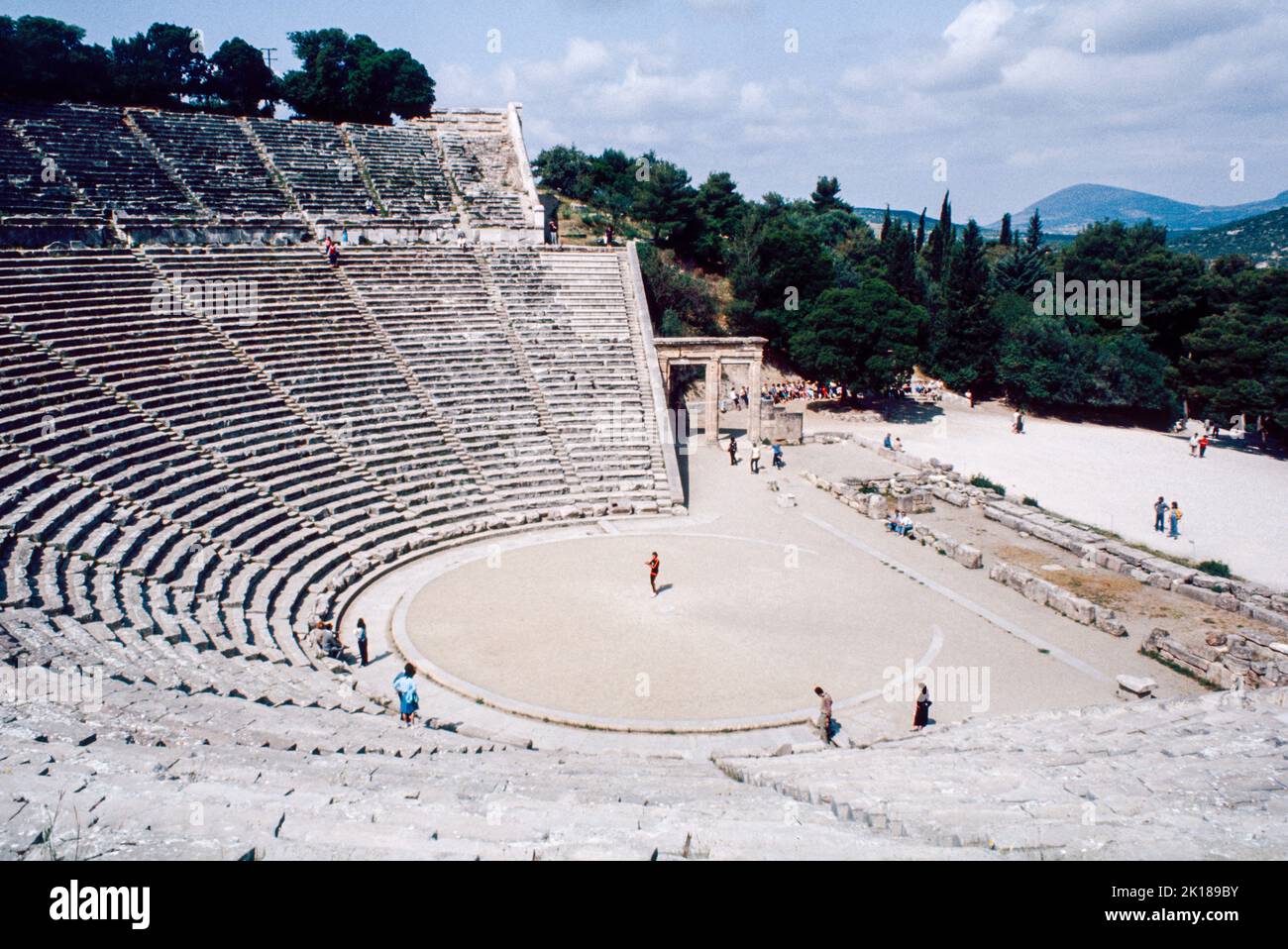 Theatre at Epidaurus - a small city (polis) in ancient Greece, on the Argolid Peninsula at the Saronic Gulf, best known for its ancient Greek sanctuary. March 1980. Archival scan from a slide. Stock Photo