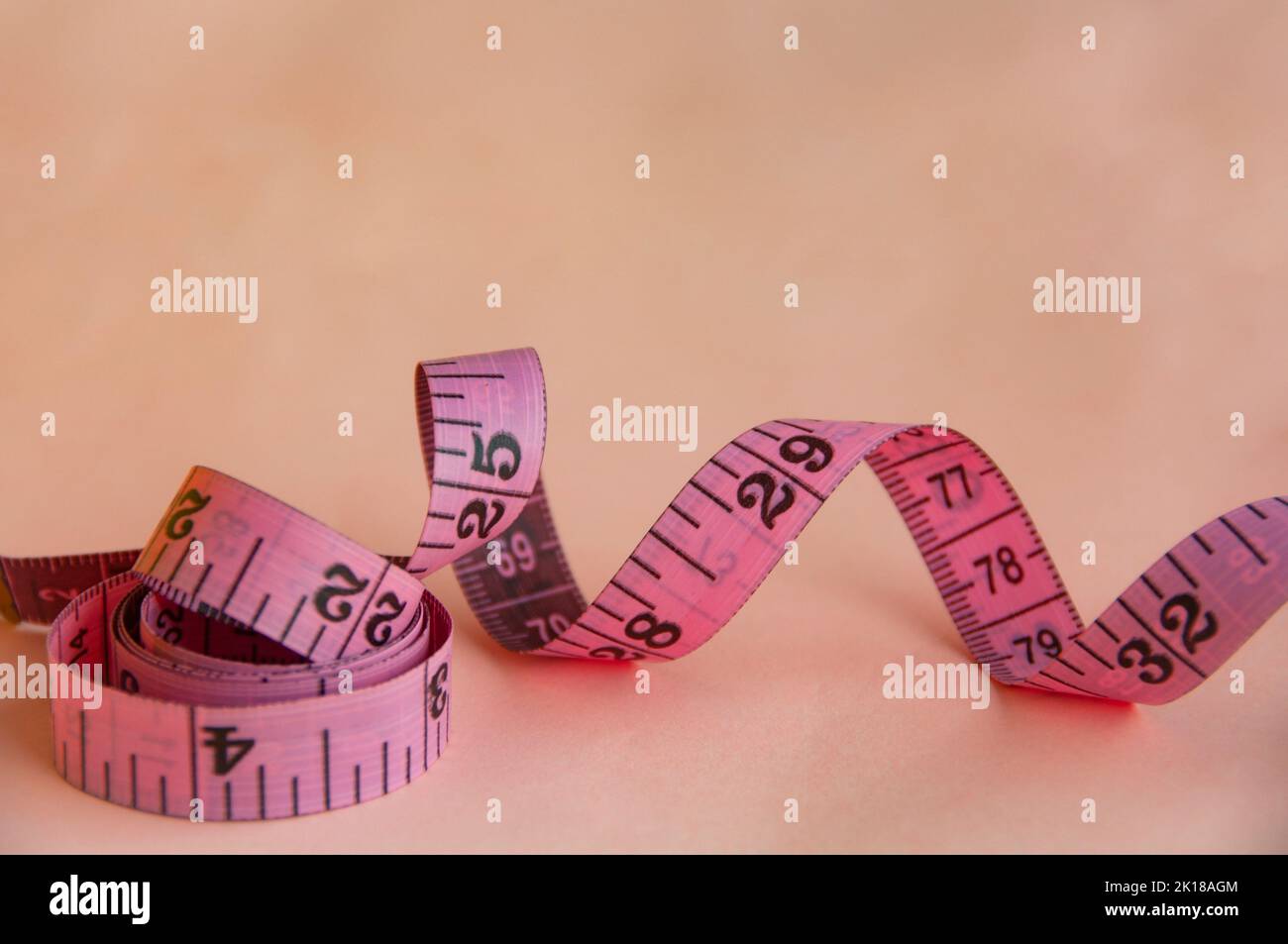 colorful measuring tapes top view on bright red background Stock Photo by  ilonadesperada