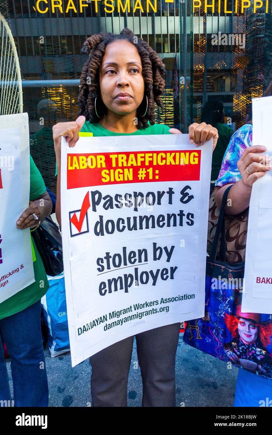 New York CIty, NY, USA, Group Immigrant WOmen Demonstrating Against Human Trafficking of Filipino Domestic Workers, Maids, Holding Protest Signs on Street, discrimination us, women with signs Stock Photo