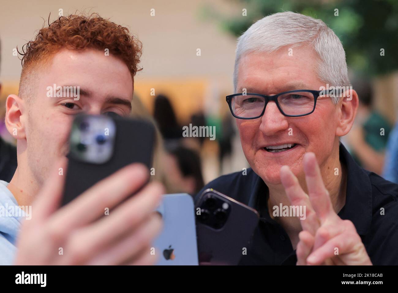 Apple CEO Tim Cook poses for a selfie at the Apple Fifth Avenue store for the release of the Apple iPhone 14 range in Manhattan, New York City, U.S., September 16, 2022.  REUTERS/Andrew Kelly Stock Photo