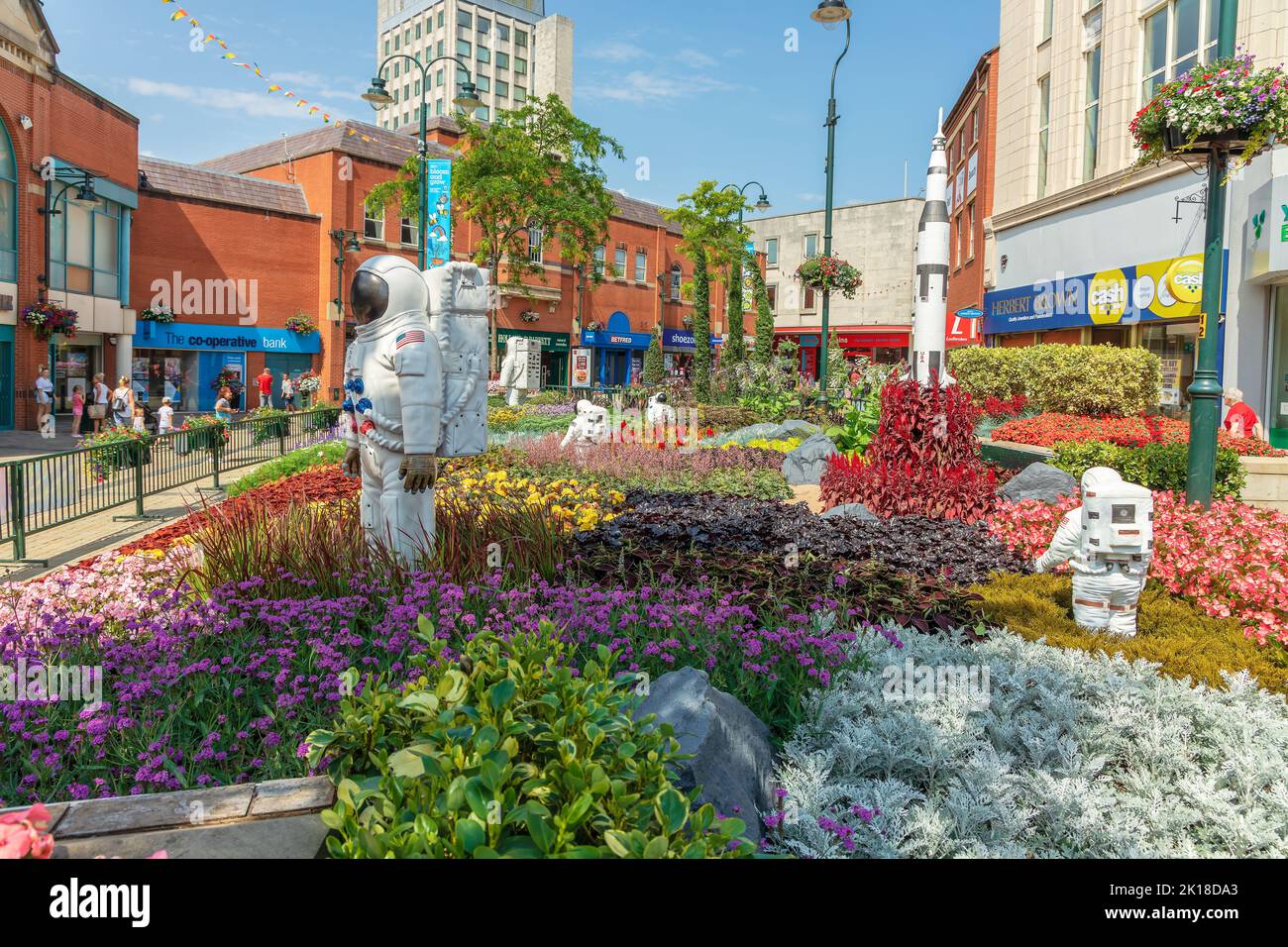 Alien landscape with American astronauts landing on the Moon theme community garden in the middle of town in Oldham, UK. Stock Photo