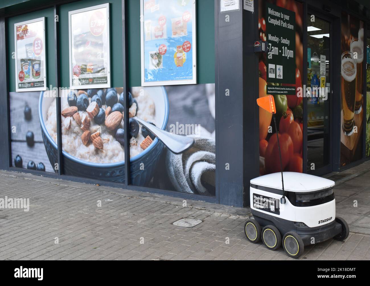 Grocery delivery robot outside a Budgen's in Milton Keynes. Stock Photo
