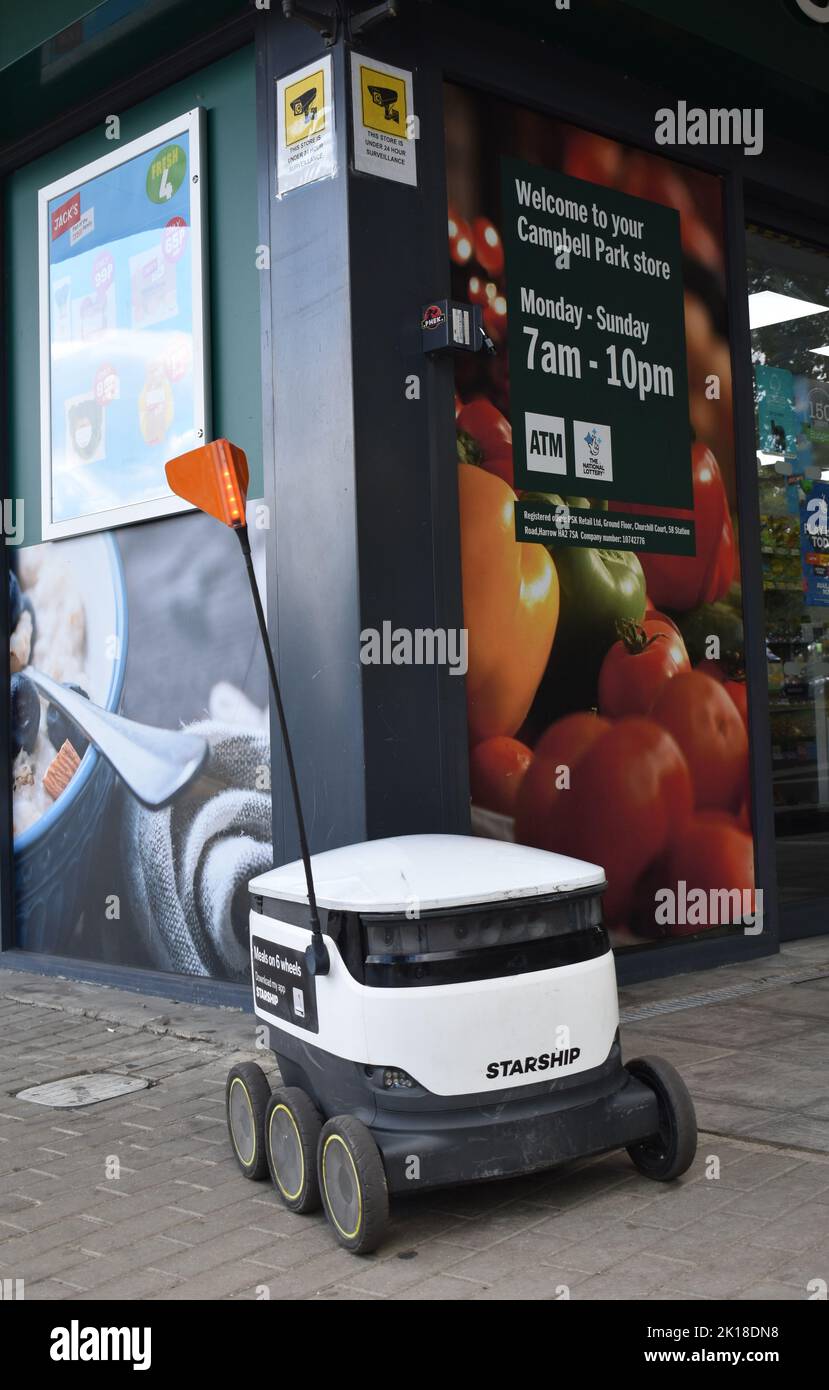 Grocery delivery robot outside a Budgen's in Milton Keynes Stock Photo