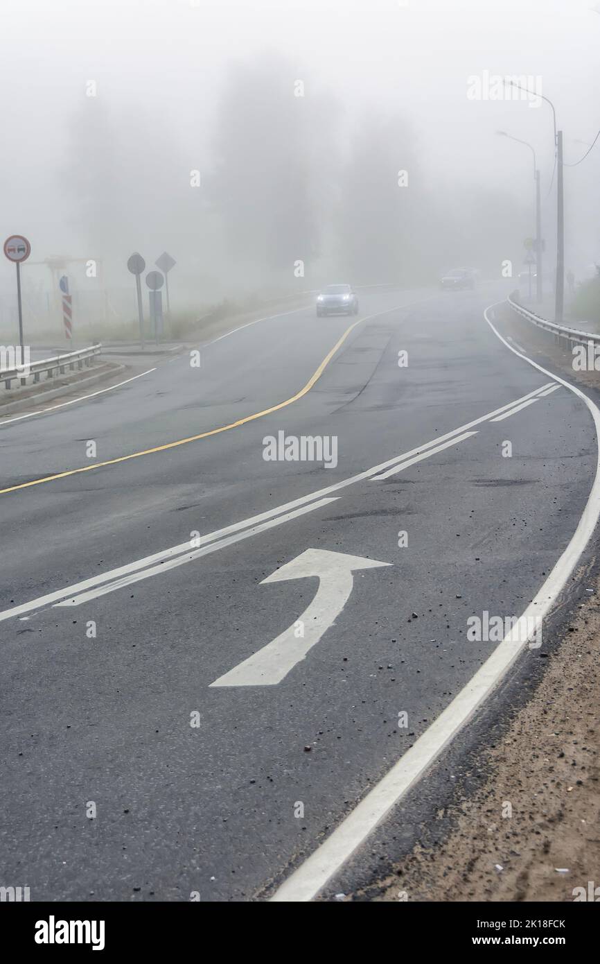 City street on a foggy morning with traffic Stock Photo - Alamy