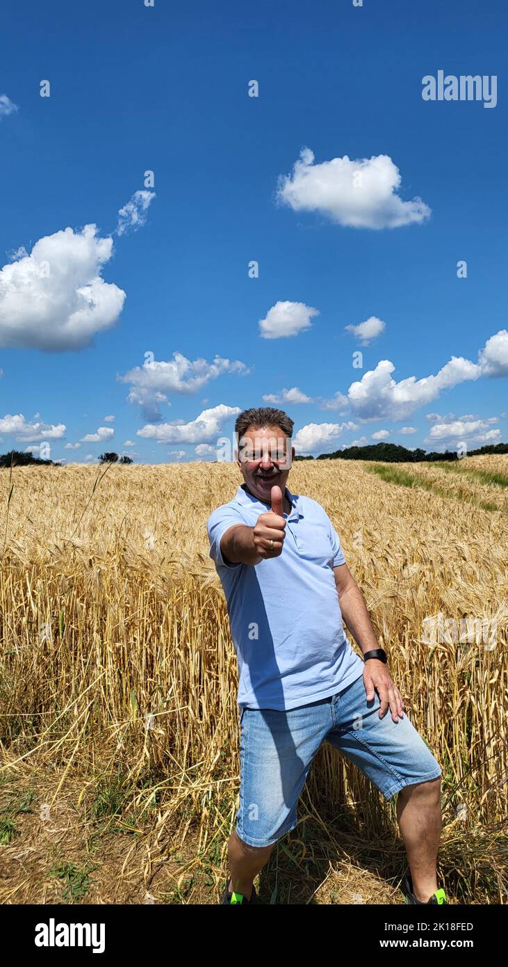 Man in front of a field is fun Stock Photo