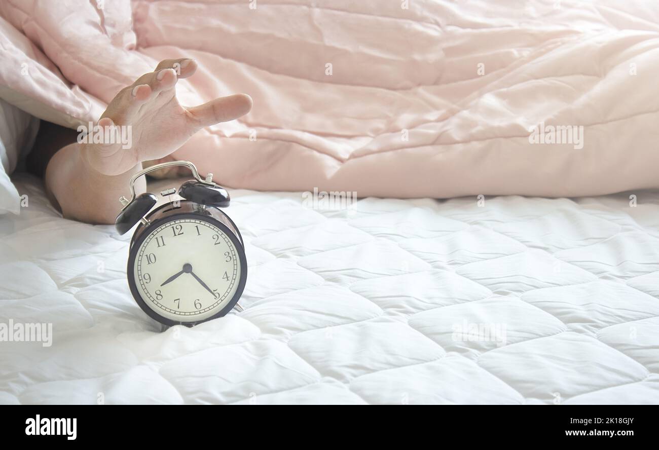 Don't want to wake up When hearing an alarm Stock Photo - Alamy