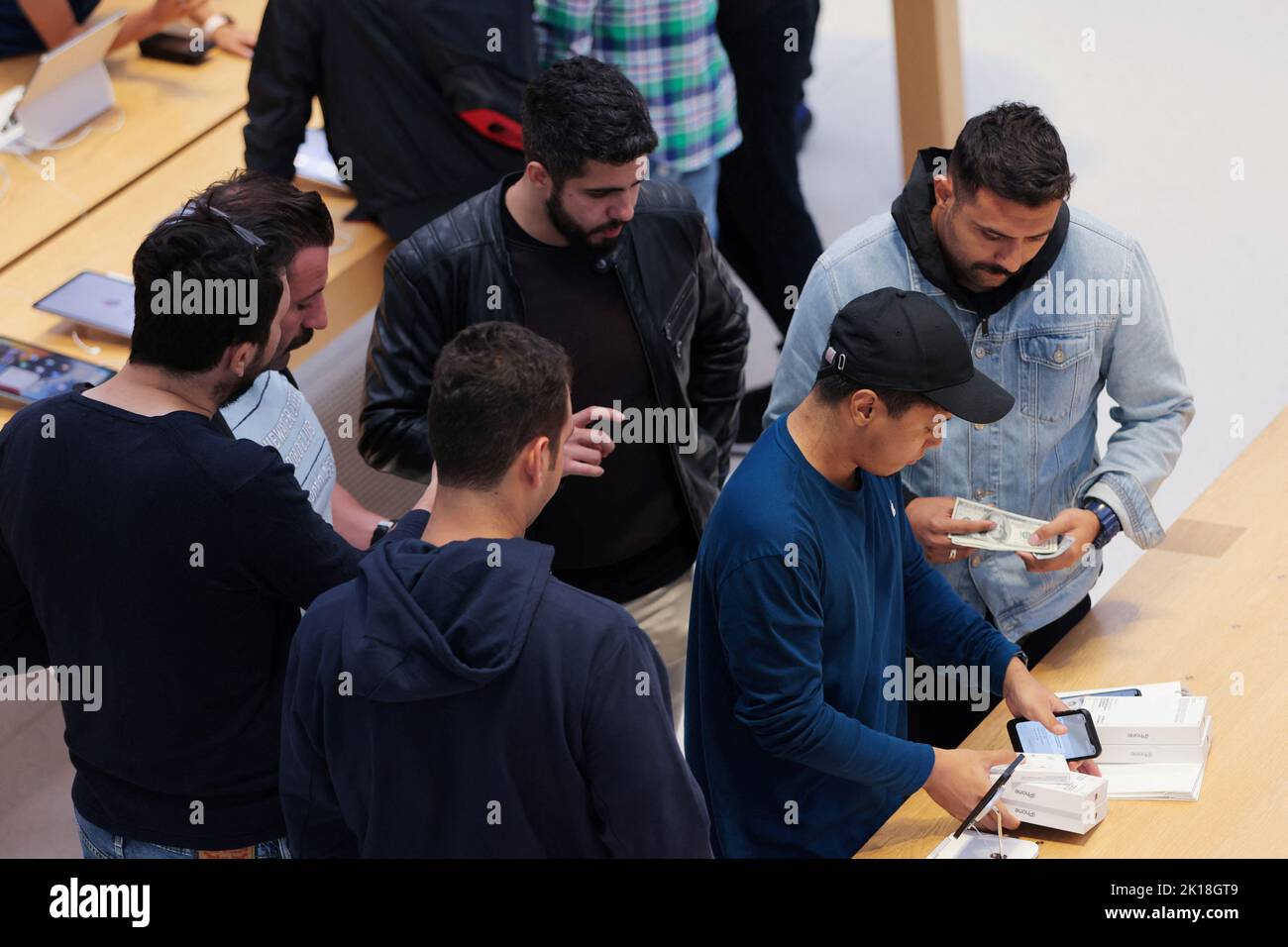 Customers shop at the Apple Fifth Avenue store for the release of the Apple iPhone 14 range in Manhattan, New York City, U.S., September 16, 2022.  REUTERS/Andrew Kelly Stock Photo