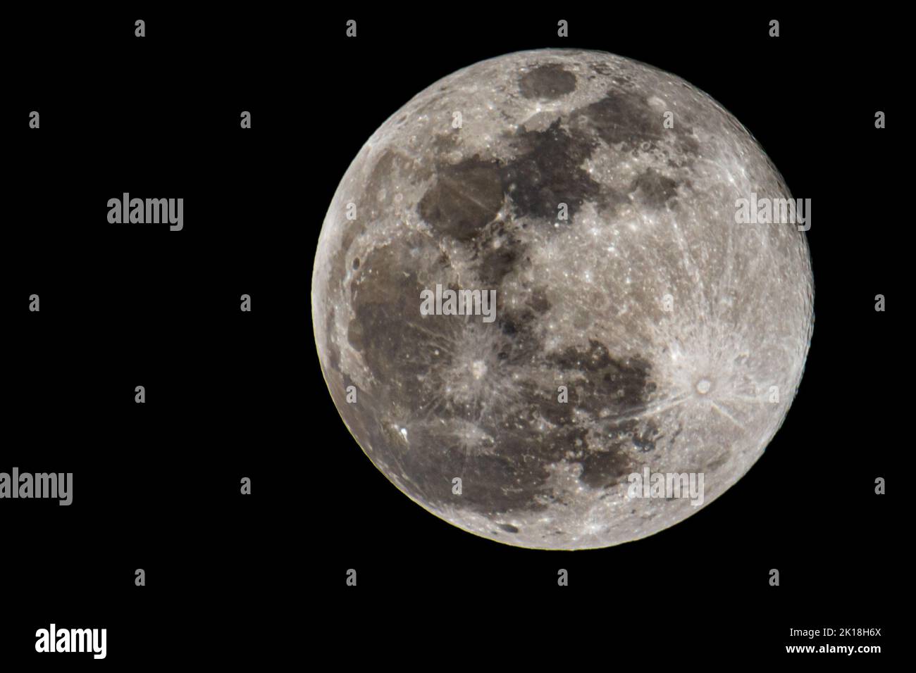 The full moon isolated in the black background Stock Photo - Alamy