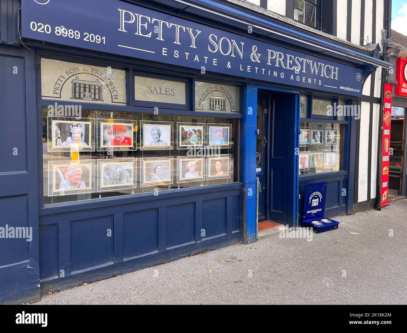 Estate agents windows in Wanstead , East London display photographs of the Queen in memory of her passing.  -September 16, 2022 Stock Photo