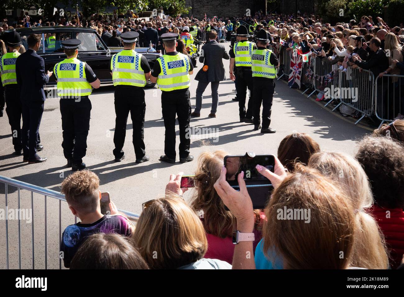 Crowds and police security waiting for King Charles III at Cardiff after the Queen Elizabeth II