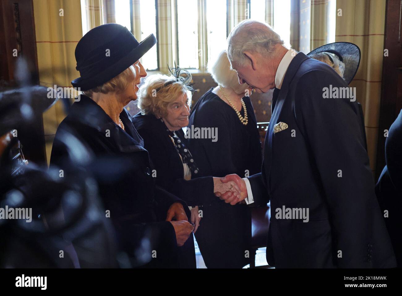 King Charles III speaks to the wives of victims of the Aberfan disaster during a reception for local charities at Cardiff Castle in Wales. Picture date: Friday September 16, 2022. Stock Photo