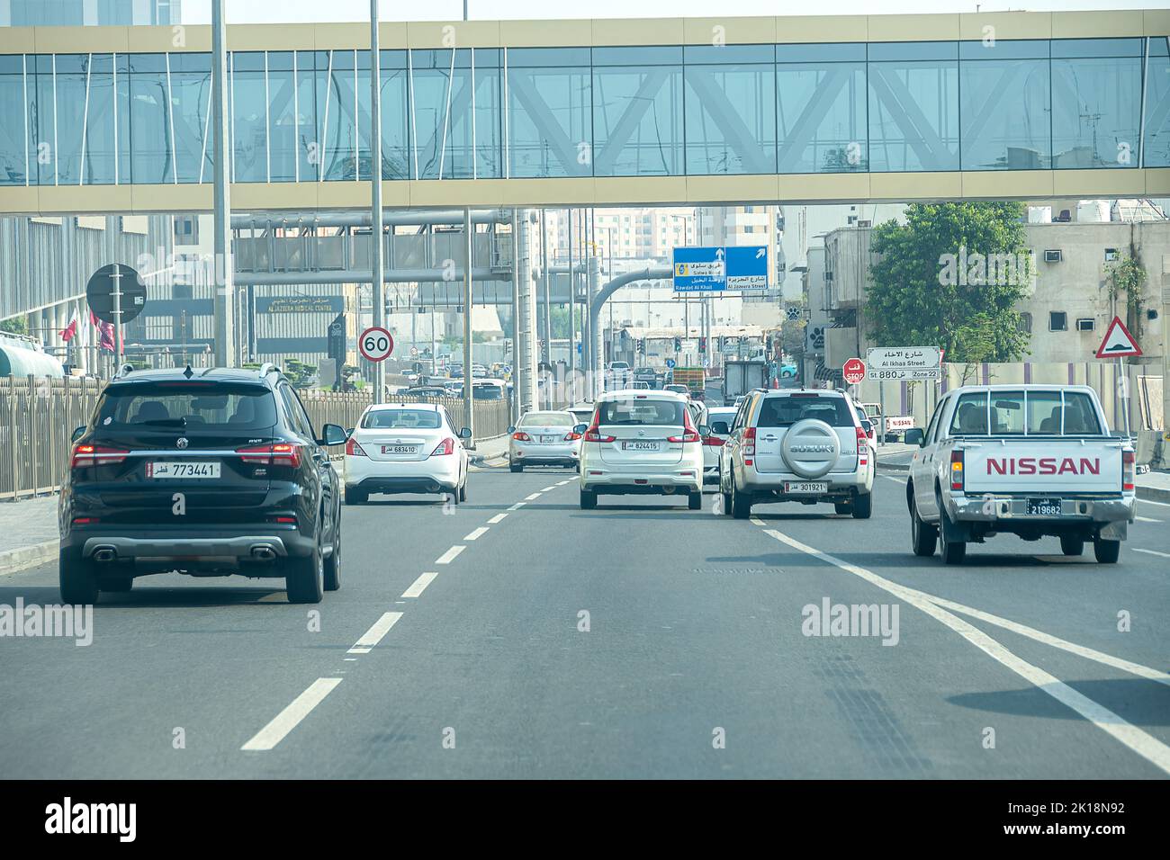 Road traffic at financial centre in Doha Beautification of Doha roads