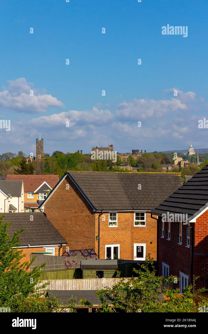 View across rooftops in the City of Lancaster Lancashire England UK towards the castle and Ashton Memorial in Williamson Park. Stock Photo