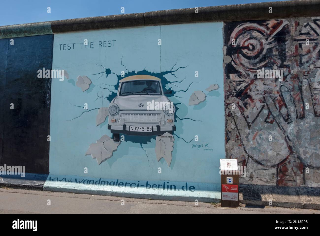 Graffiti painting 'Test the Rest' by Birgit Kinder. 2009. East Side Gallery memorial. Mühlenstrasse (Mill Street). Friedrichshain, Berlin. Germany Stock Photo