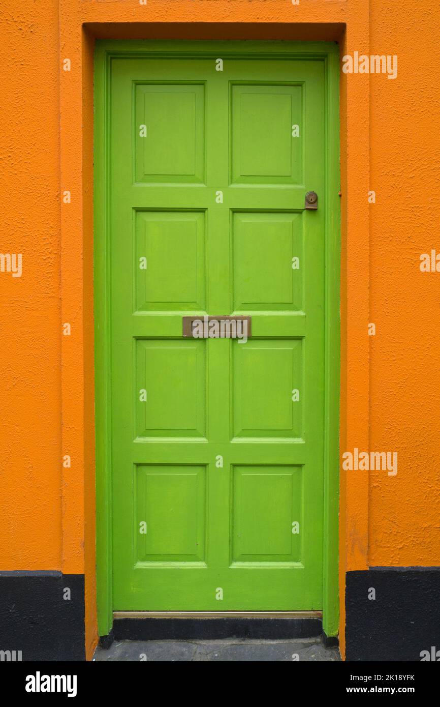 Green door in colourful house, County Kerry, Ireland Stock Photo
