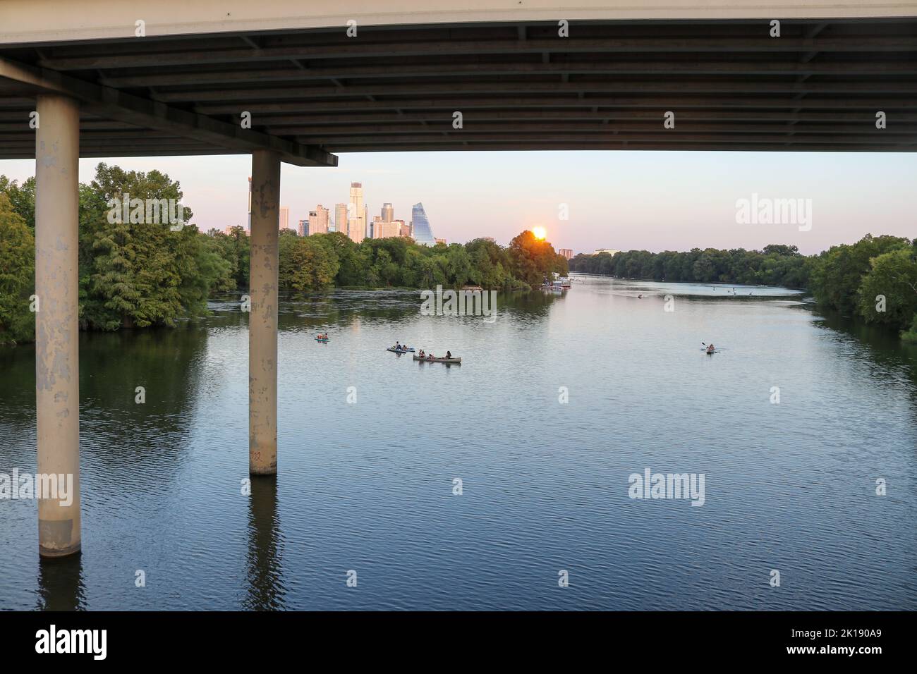People kayaking and paddleboarding on the Colorado River in Austin ...