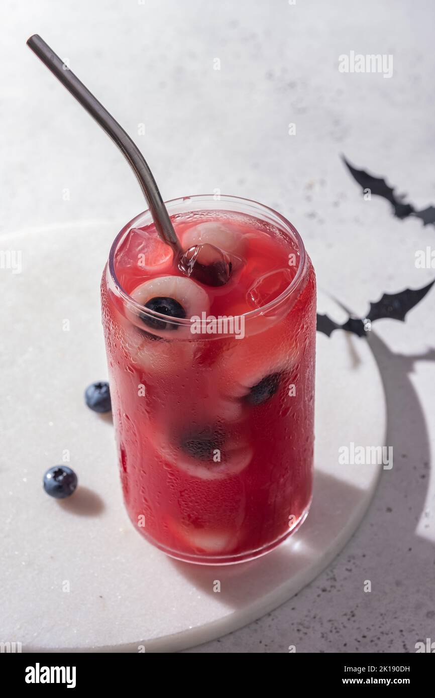 Red halloween cocktail with eyeballs Stock Photo