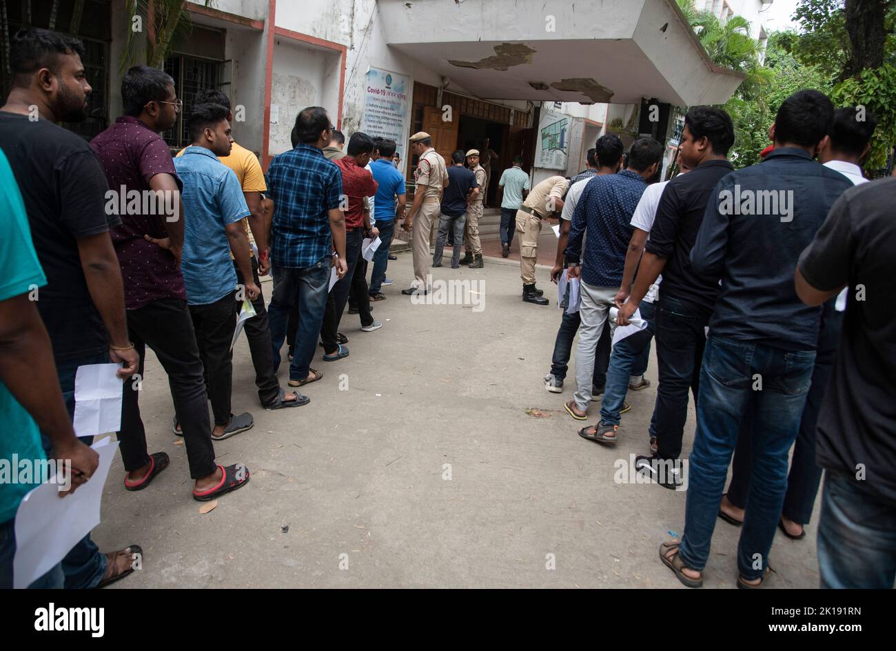 GUWAHATI, INDIA - AUGUST 28: Aspirants arrive to appear  in a written examination for Recruitment of Class III and IV posts, at a examination centre on August 28, 2022 in  Guwahati, India. More than 1.4 million candidates are expected to appear for nearly 30,000 Grade-III and -IV posts in Assam. Mobile internet services across 25 districts of Assam have been suspended during exam in order to prevent possible malpractices. Stock Photo