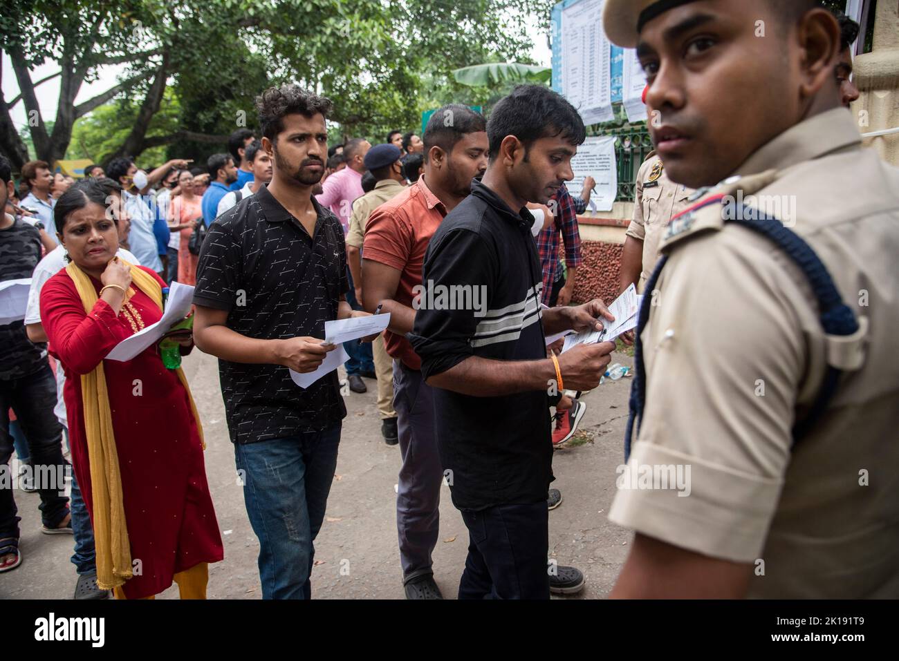 GUWAHATI, INDIA - AUGUST 28: Aspirants arrive to appear  in a written examination for Recruitment of Class III and IV posts, at a examination centre on August 28, 2022 in  Guwahati, India. More than 1.4 million candidates are expected to appear for nearly 30,000 Grade-III and -IV posts in Assam. Mobile internet services across 25 districts of Assam have been suspended during exam in order to prevent possible malpractices. Stock Photo