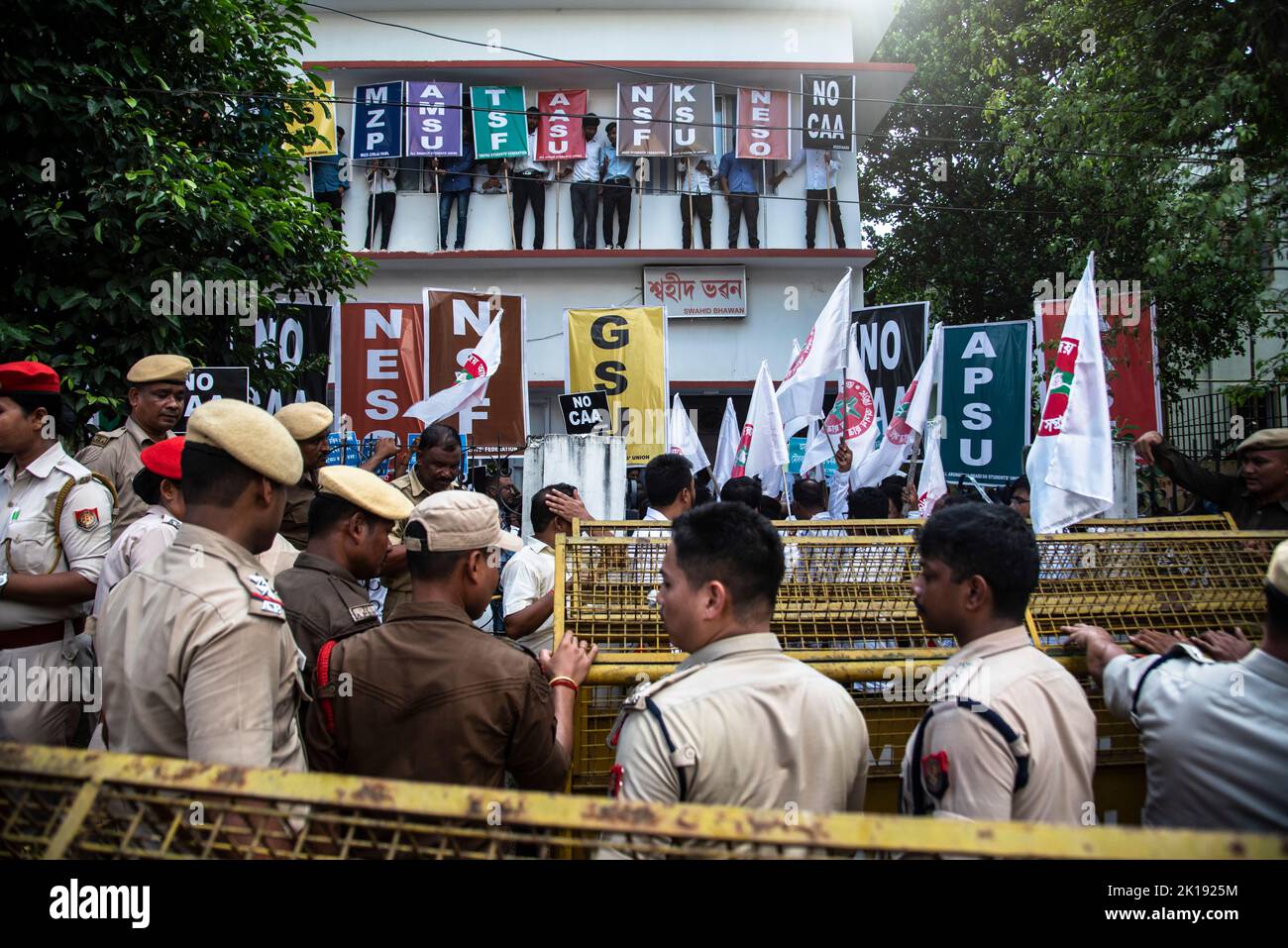 GUWAHATI, INDIA - AUGUST 17: Police personnel stand guard as North-East Students Organisation (NESO) leaders and activists stage a protest demanding scrapping of  Citizenship Amendment Act (CAA) on August 17, 2022 in Guwahati, India. Several student organisations in the northeast India renewed protests against the controversial Citizenship Amendment Act (CAA) after nearly two years. Stock Photo