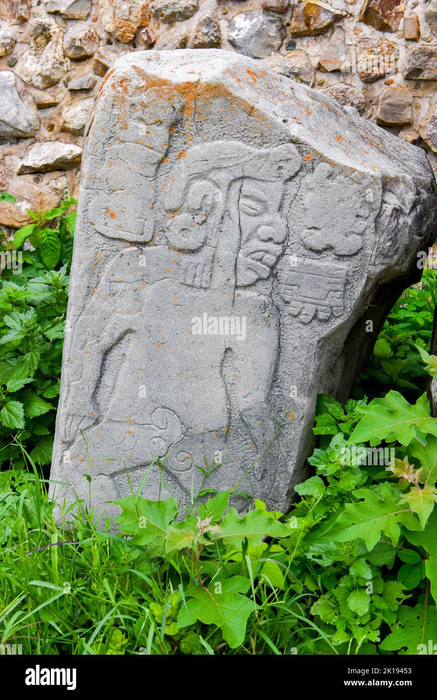 The famous Los Danzantes, carved stone monuments next to building L, Monte Alban Archeological site, Zapotec civilization ruins, Oaxaca, Mexico Stock Photo