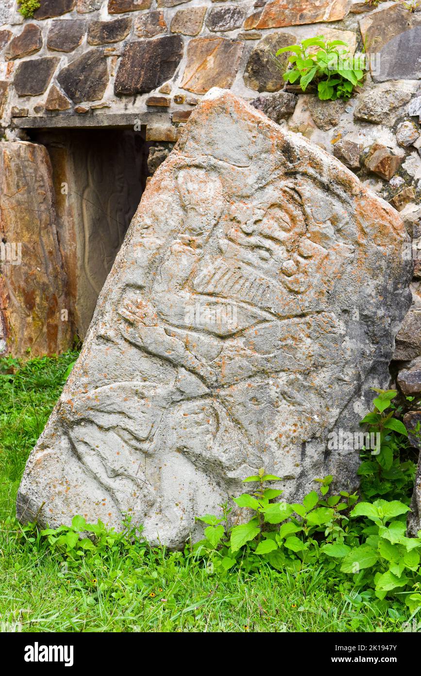 The famous Los Danzantes, carved stone monuments next to building L, Monte Alban Archeological site, Zapotec civilization ruins, Oaxaca, Mexico Stock Photo