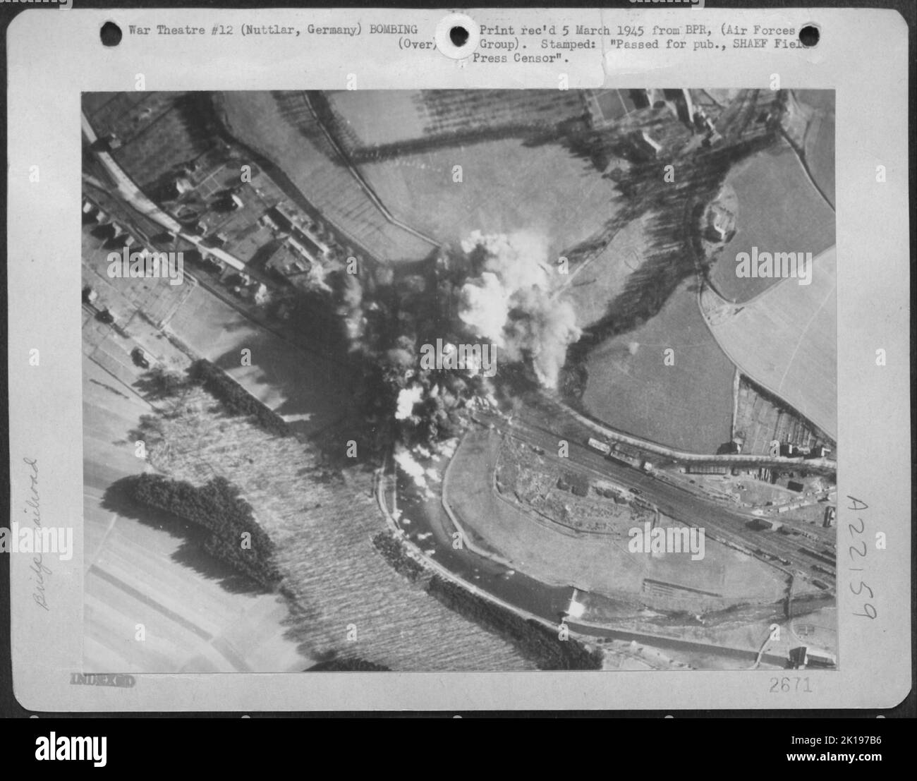 Well Developed Bomb Bursts Pattern A Railroad Bridge And Adjacent Highway Span At Nuttlar, Germany Near Bestwig, Following An Attack By 9Th Bombardment Division Martin B-26 Marauders Feb. 22 1945. Direct Hits Were Scored On The Railroad Bridge. Stock Photo