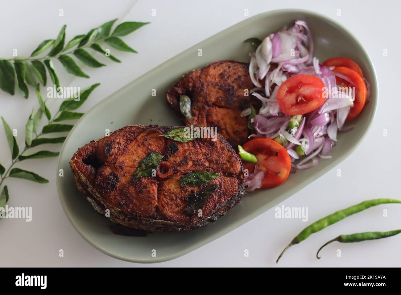 Crispy Surmai fish fry. Shallow fried king fish in Kerala style served