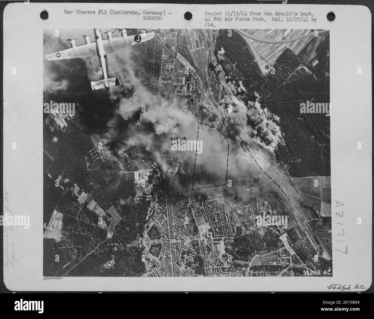 Consolidated B-24s of the 453rd Bomb Group fly over the burning targets at Karsruhe, Germany, after dropping their bombs on enemy installations 5 Sept. 1944. Stock Photo