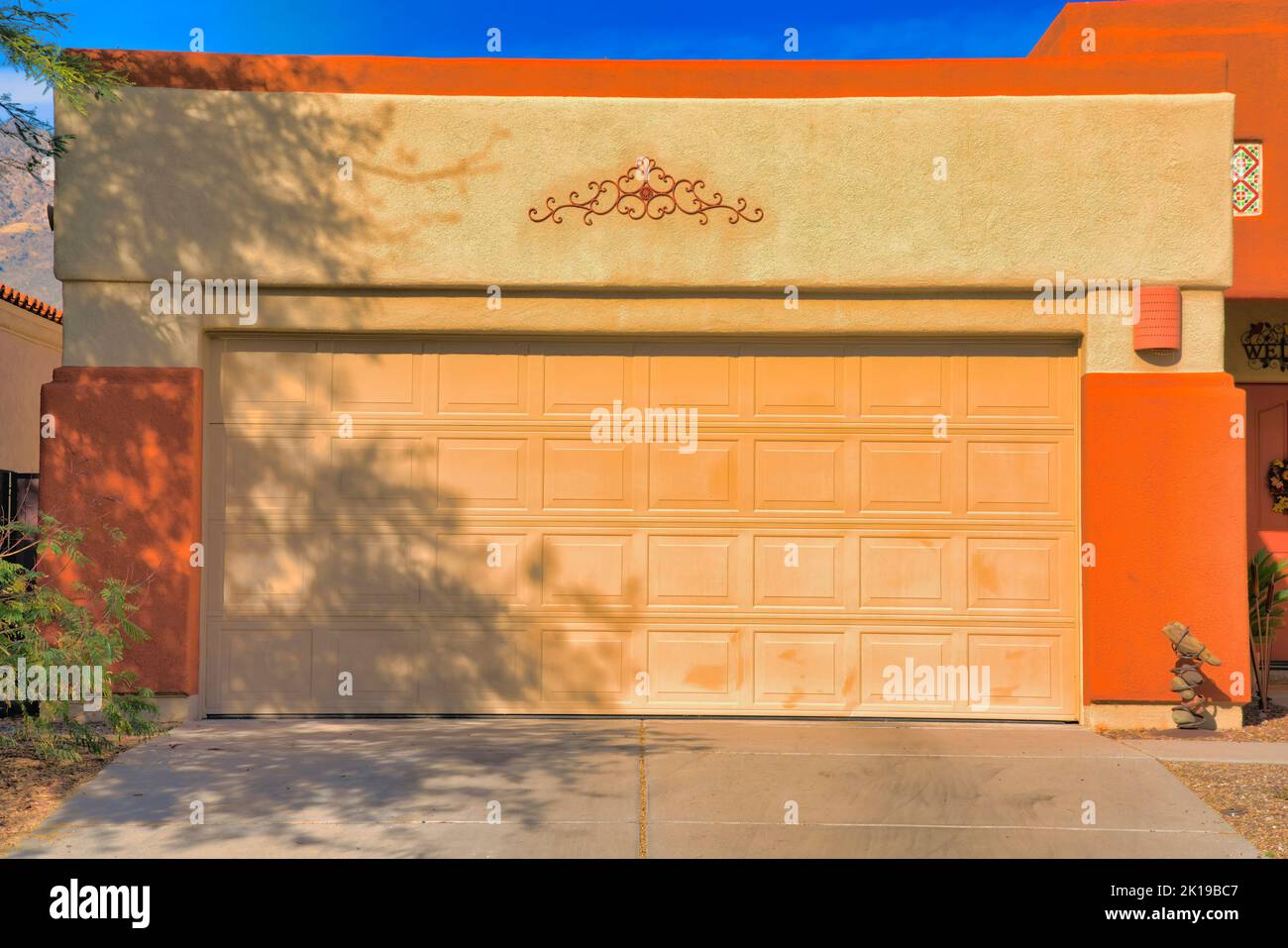 Large sectional garage door with concrete driveway in Tucson, Arizona