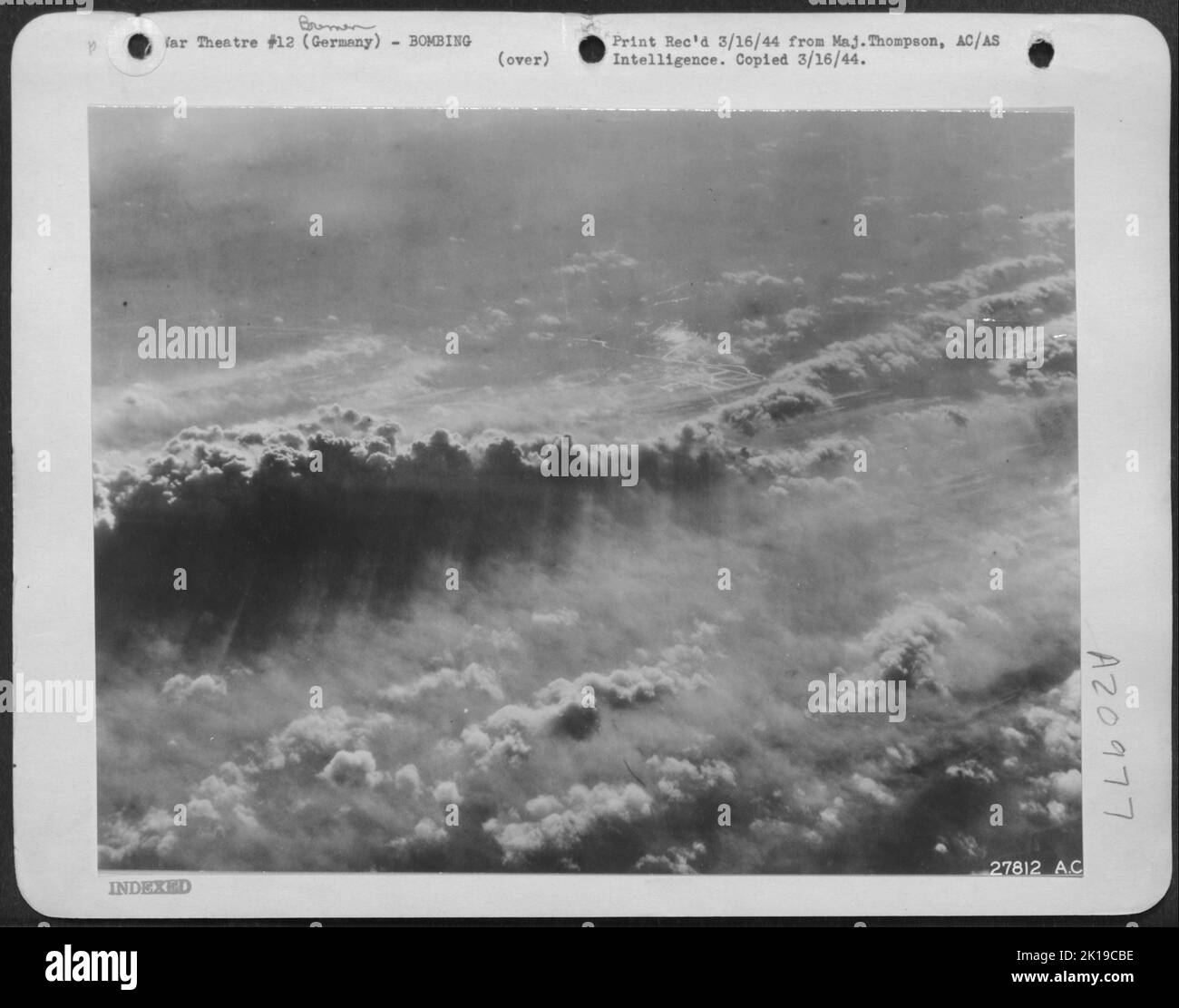 BREMEN AFIRE. Rising Columns of black smoke intermingled with clouds as