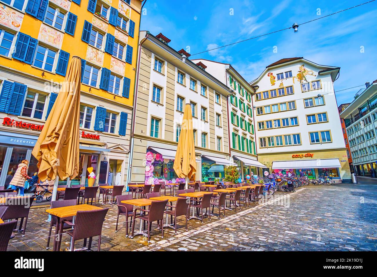 LUCERNE, SWITZERLAND - MARCH 30, 2022: Walk along medieval streets, enjoying frescoes on facades of houses, on March 30 in Lucerne, Switzerland Stock Photo