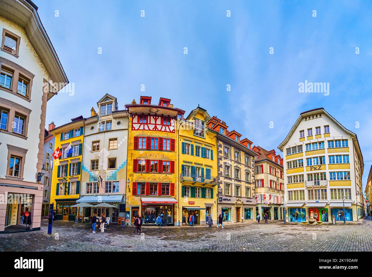 LUCERNE, SWITZERLAND - MARCH 30, 2022: Panorama of Kronmarkt square with medieval wall frescoes on facades of houses, on March 30 in Lucerne, Switzerl Stock Photo