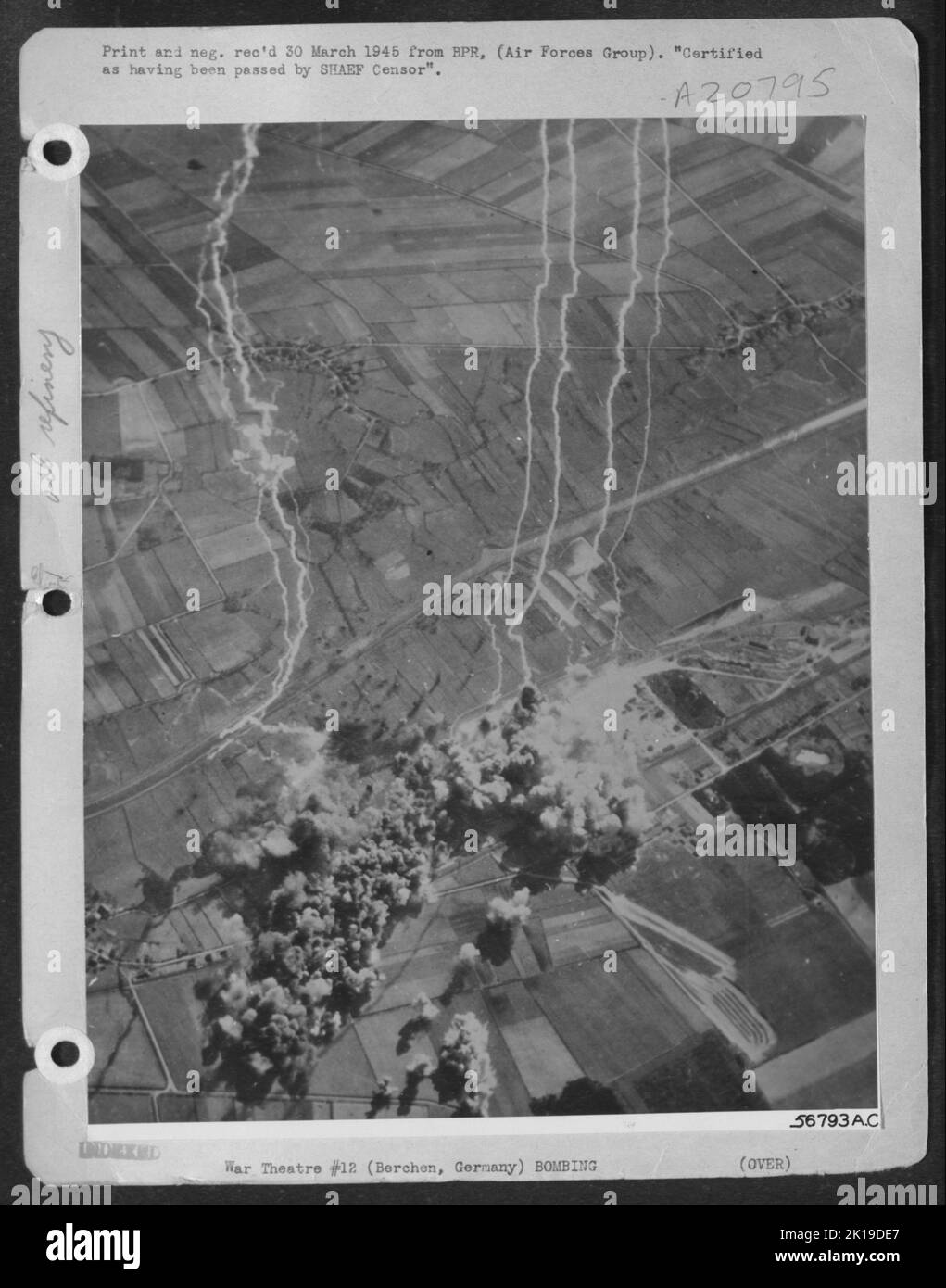 UNDERGROUND OIL STORAGE DEPOT HIT--Bombs released from 250 Consolidated B-24 Liberators of the U.S. 8th AF over Berchen in northwest Germany hit underground oil storage depots on 25 March 1945. The target was one of three similar ones Stock Photo