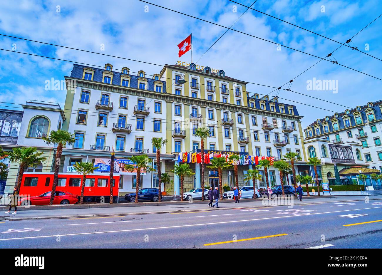 LUCERNE, SWITZERLAND - MARCH 30, 2022: Facade of Schweizerhof Hotel on Schweizerhofquai embankment, on March 30 in Lucerne, Switzerland Stock Photo