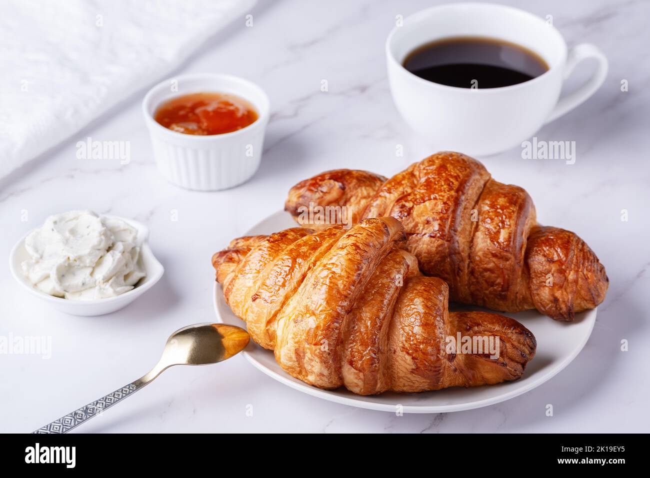 Croissant and a cup of tea French breakfast, Stock image