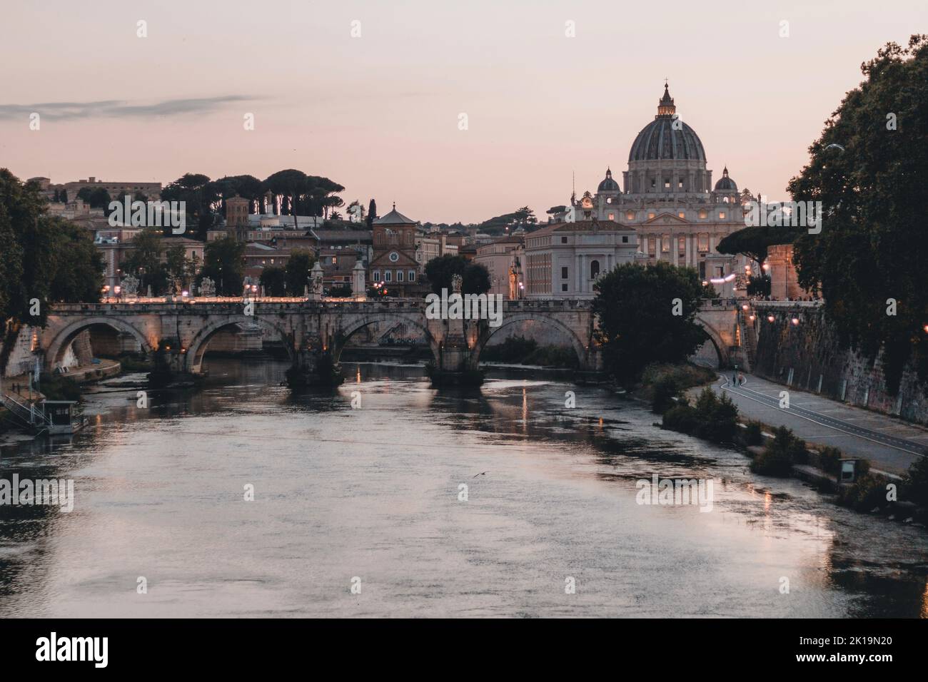 The San Pietro church on the other side of the river at sunset in the Vatican, vertical shot Stock Photo